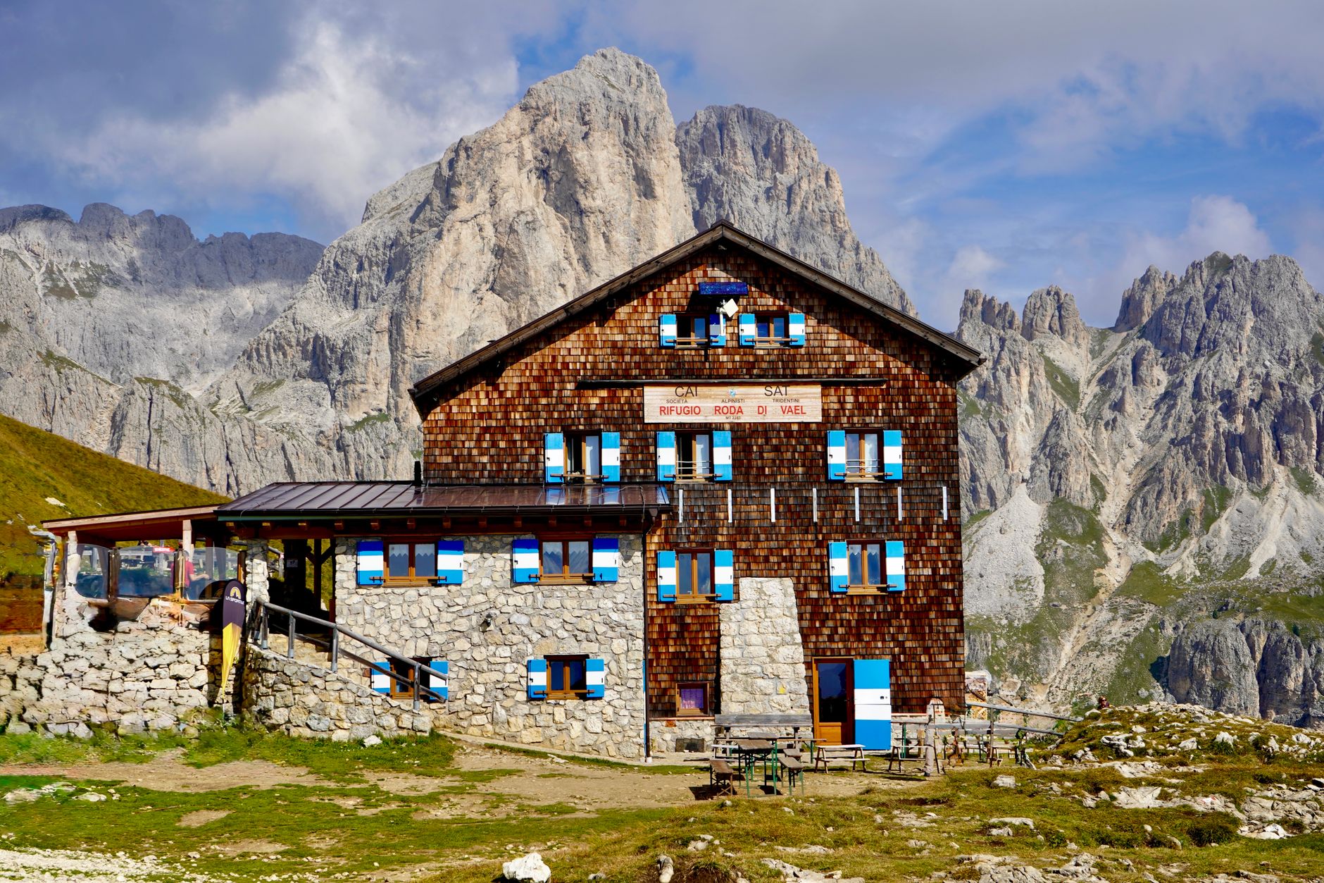 Jagged dolomite limestone peaks towering above high alpine pasture